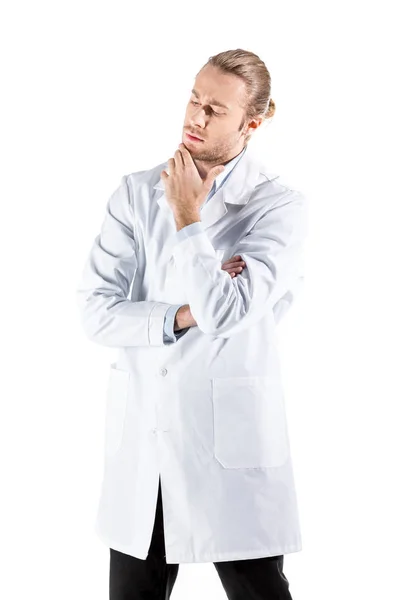 Pensive doctor in white coat — Stock Photo