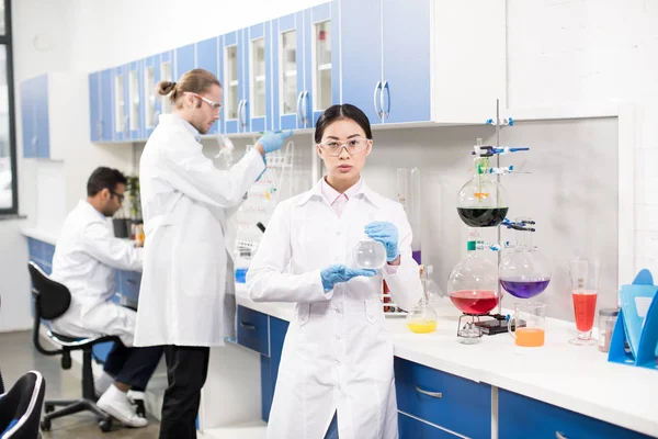 Young scientists in laboratory — Stock Photo