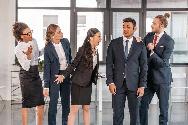 Businesspeople in formalwear quarrelling at office — Stock Photo