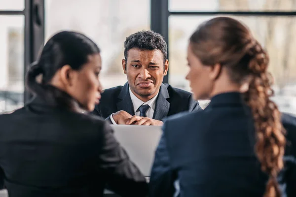Coworkers in formalwear arguing at business meeting — Stock Photo