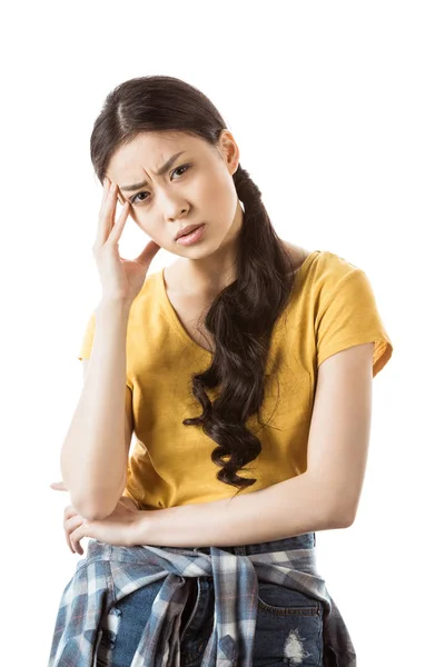 Young asian girl in thoughtful pose — Stock Photo