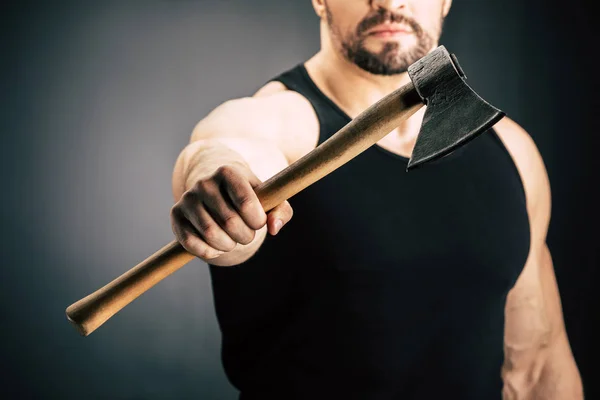 Sportive man holding axe — Stock Photo