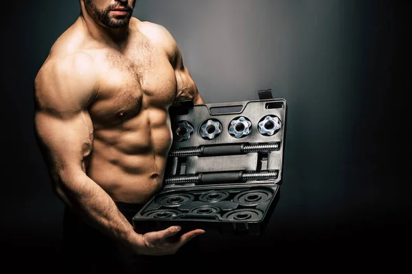 Shirtless man with sports equipment — Stock Photo