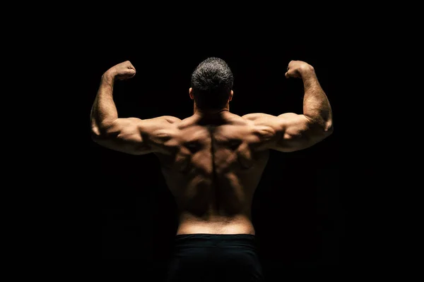 Shirtless sportive man showing muscles — Stock Photo