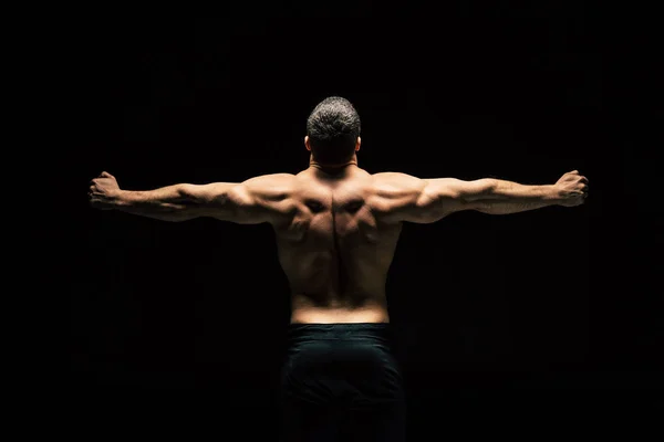 Shirtless sportive man showing muscles — Stock Photo