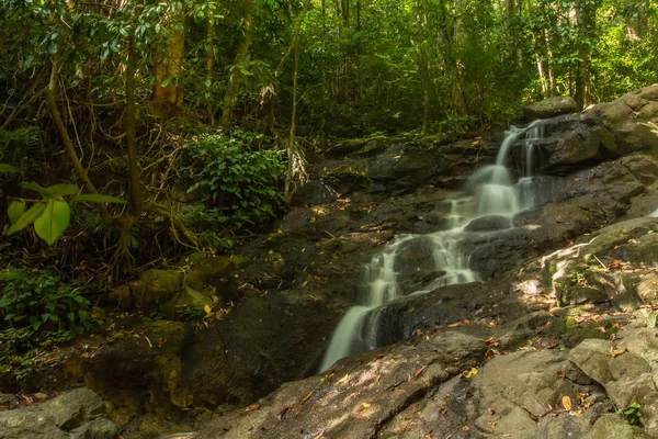 Kathu Waterfall in the tropical forest area In Asia, suitable for walks, nature walks and hiking, adventure photography Of the national park Phuket Thailand,Suitable for travel and leisure.