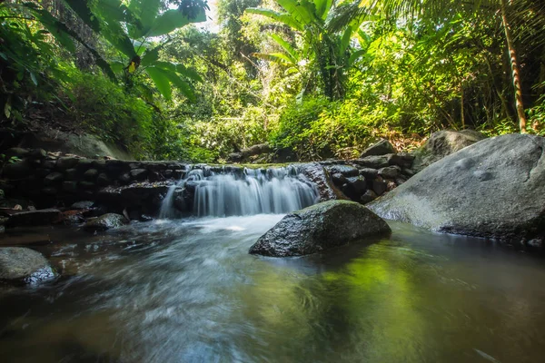 Kathu Waterfall in the tropical forest area In Asia, suitable for walks, nature walks and hiking, adventure photography Of the national park Phuket Thailand,Suitable for travel and leisure.