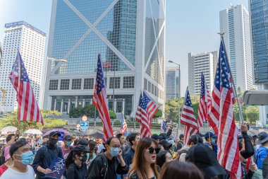 Hong Kong - 29 November 2019: Peaceful march to American consulate calling for help from US President Donald Trump, by passing Hong Kong Human Rights and Democracy Act. clipart