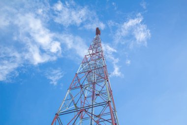 Telecommunication tower against,on the hill Blue sky with cloud bright at Phuket Thailand.