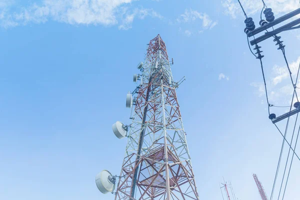 Telecommunication tower against,on the hill Blue sky with cloud bright at Phuket Thailand.