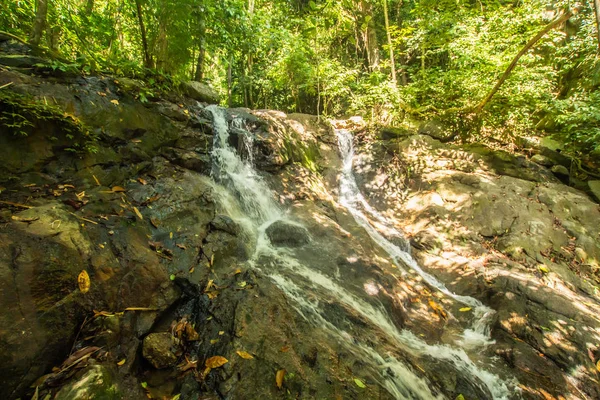 Kathu Waterfall in the tropical forest area In Asia, suitable for walks, nature walks and hiking, adventure photography Of the national park Phuket Thailand,Suitable for travel and leisure.