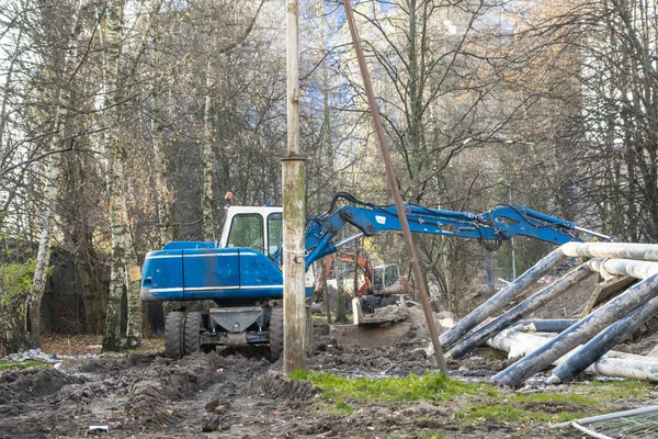 blue excavator is engaged in excavation work in the Park1