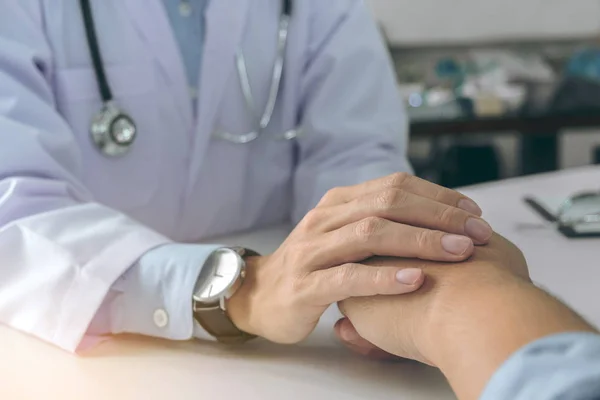 Close up of doctor touching patient hand for encouragement and e — Stock Photo, Image