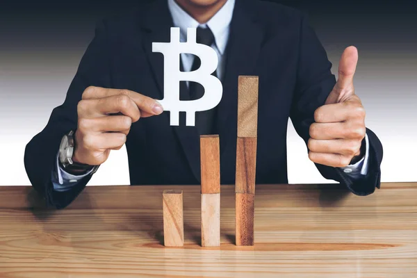 Financial growth concept, Businessman holding showing bitcoin sy — Stock Image Financial growth concept, Businessman holding showing bitcoin sy Stock Picture