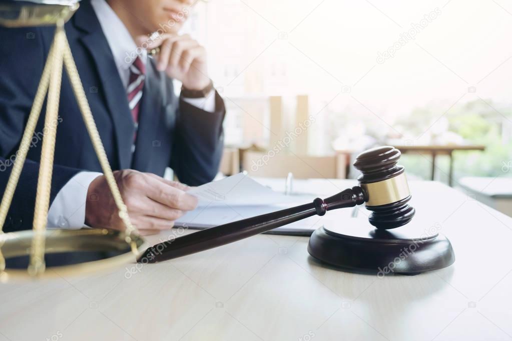 Close up of gavel, Male lawyer working with scales of justice, b