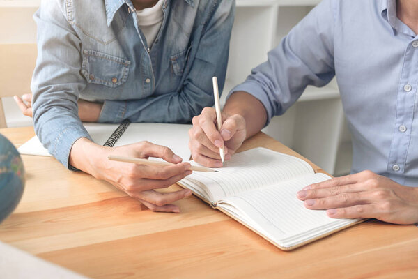 Tutor books with friends, Young students campus or classmates he