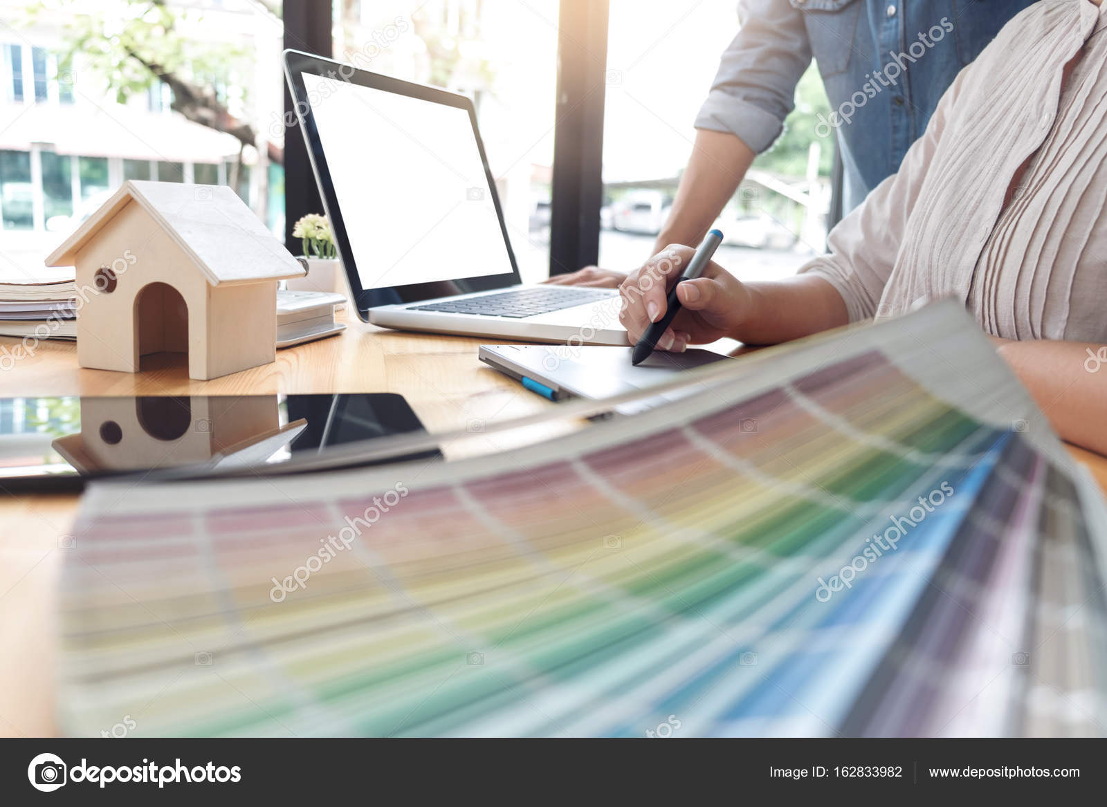 Young colleagues designers working together on a creative projec Stock ...