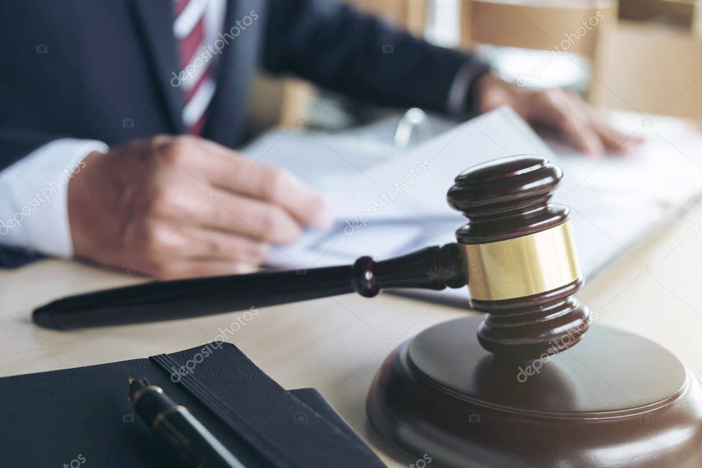 Close up of gavel, Male lawyer working with scales of justice, b