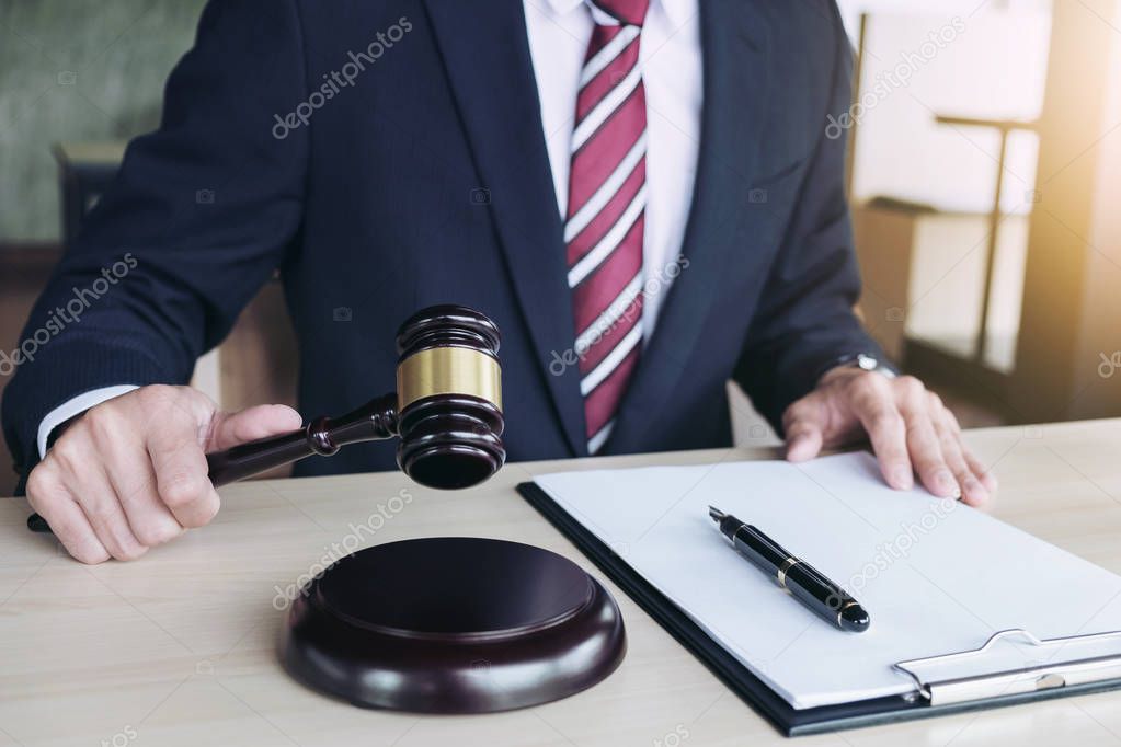 Close up of hand, Judge hitting gavel and scales of justice, Rep