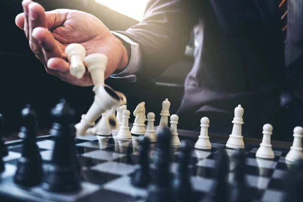Close up of hands confident businessman colleagues playing chess — Stock Photo, Image