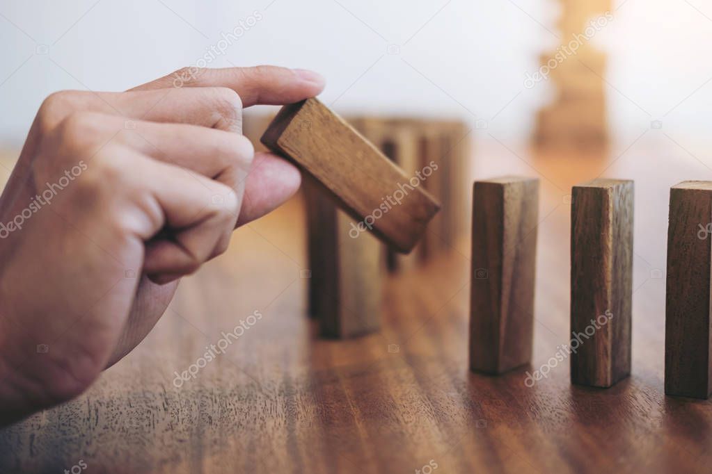 Risk and strategy in business, Close up of businessman hand gamb