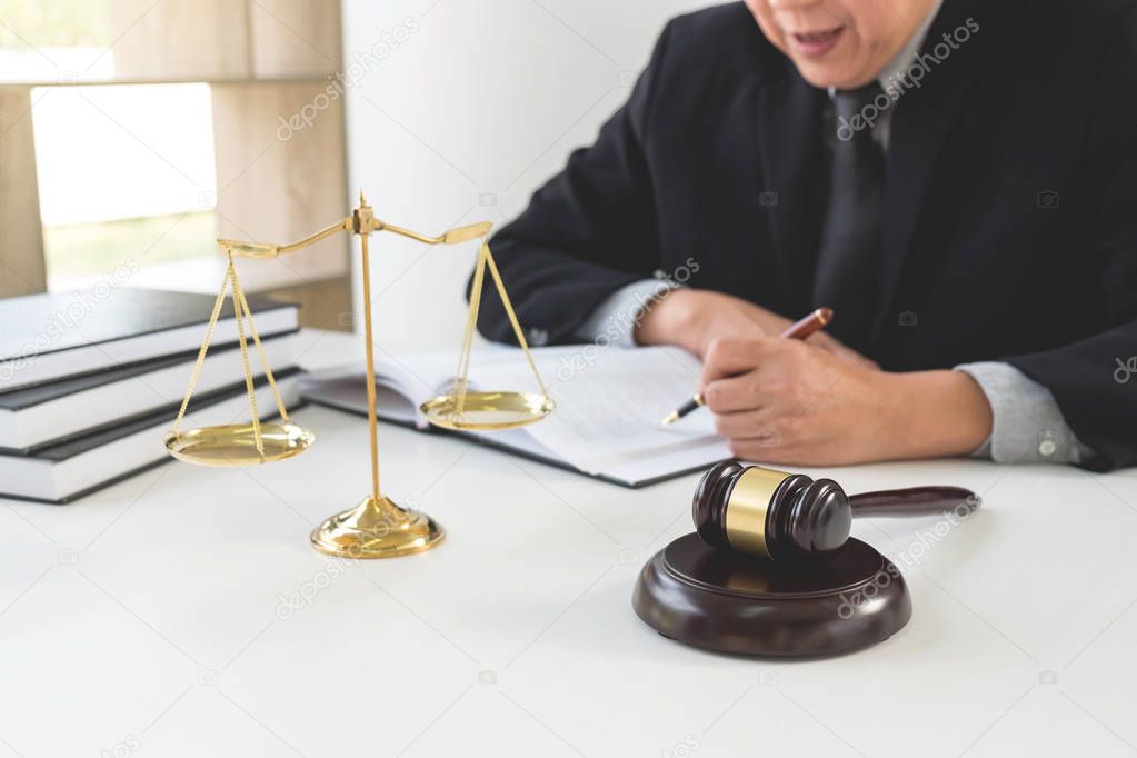 Close up of gavel, Male lawyer or judge working with Law books, 