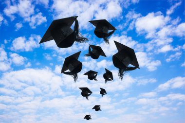 Graduation day, Images of graduation Caps or hat throwing in the air with sunshine day on blue sky background, Happiness feeling, Commencement day, Congratulation, Ceremony. clipart