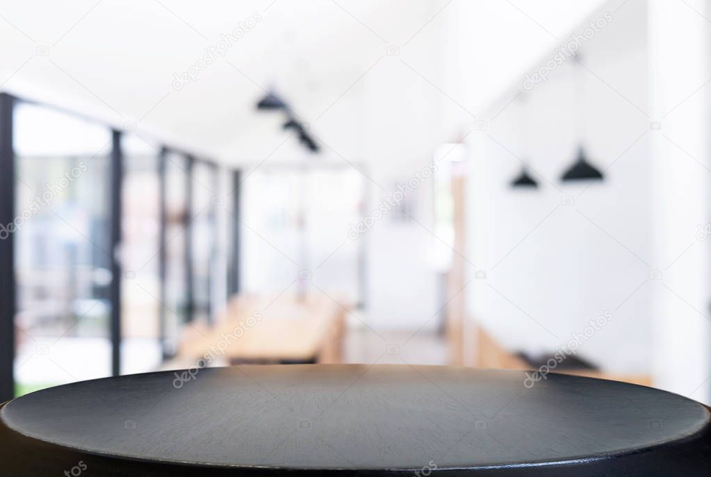 Empty wooden table and blurred background of abstract in front o