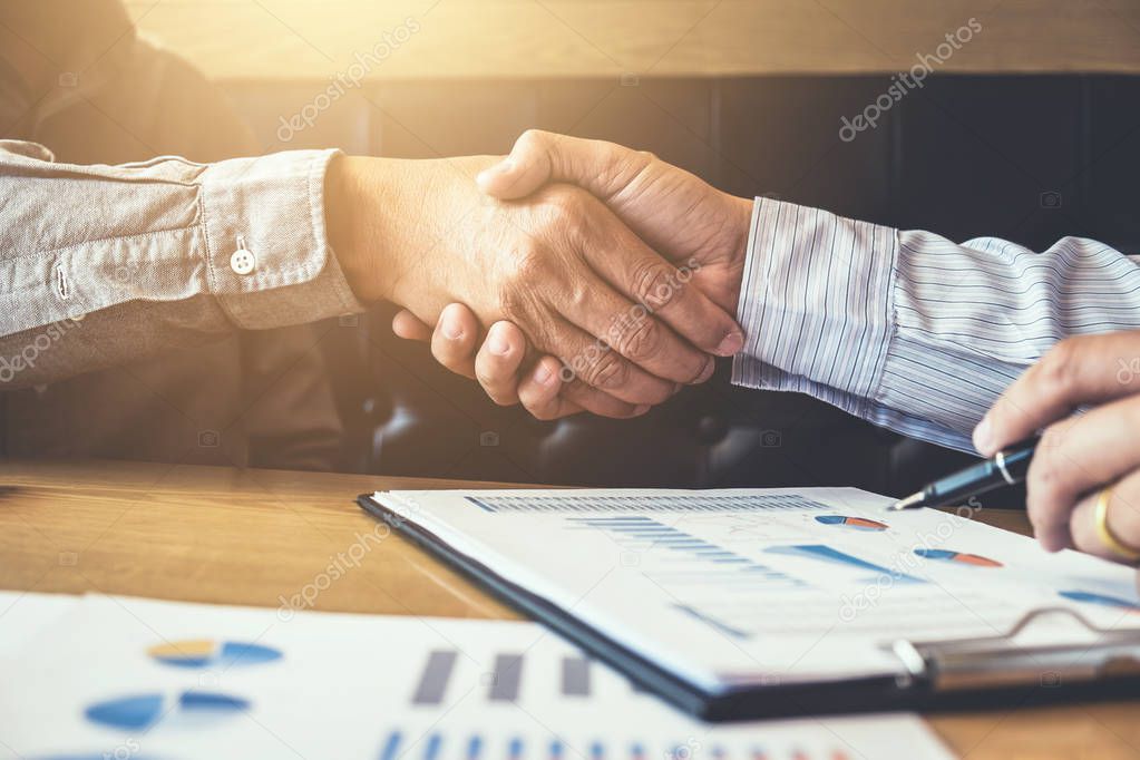 Meeting and greeting, Two executive businessman handshake after 