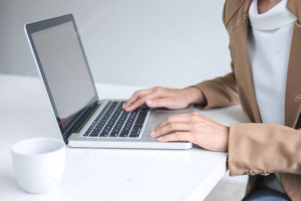 Young Entrepreneur woman manager working indoors at a modern off