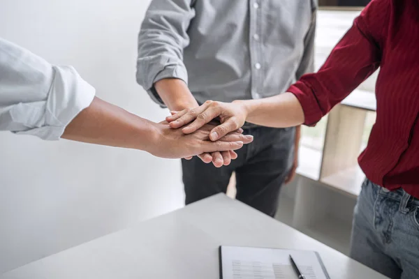 Image of business people joining and putting hands together during their meeting, connection and collaboration concept, Teamwork process of partner and best relationship.