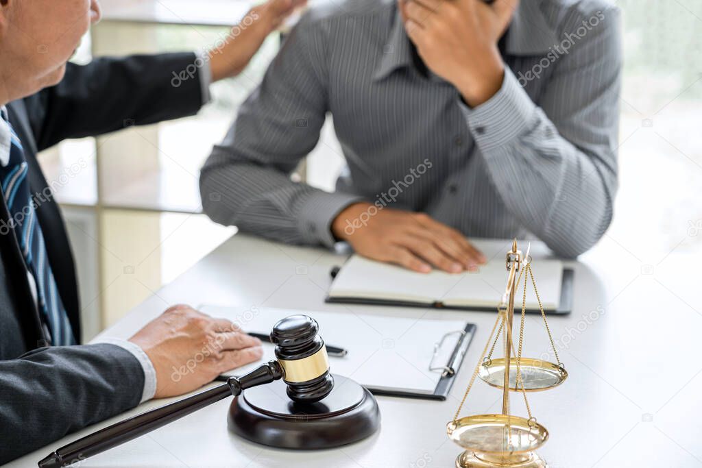 Judge gavel with scales of justice, Businessman and lawyer or counselor consulting and discussing contract papers at law firm in office.