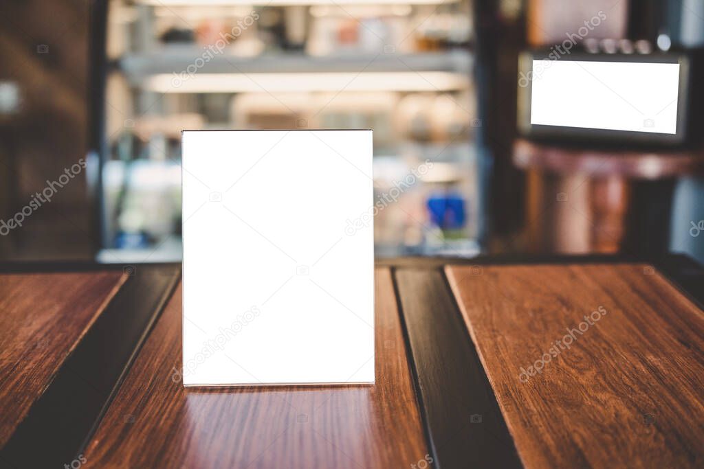 Mock up acrylic frame posters pattern template forms background, blank menu frame on table in coffee shop stand for your text of display your product.