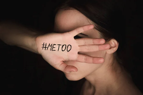 Girl covers her face with hand with hashtag metoo against harassment — Stock Photo, Image