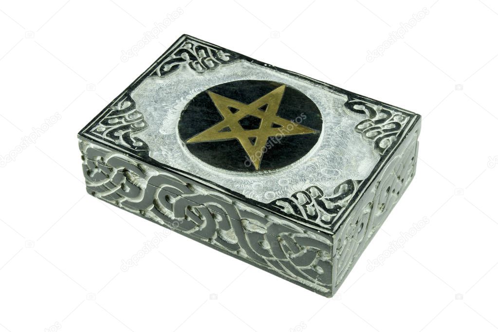 Still life with closed stone esoteric mystic box with carved sign pentagram and ornaments isolated on white background