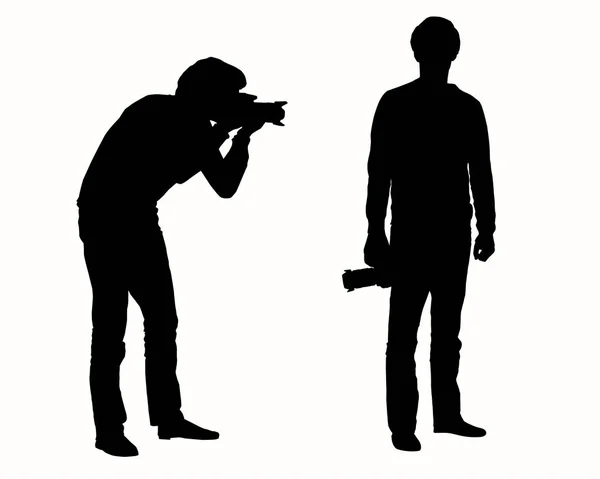 Set of realistic vector silhouettes of kneeling and standing photographer with telephoto and backpack, isolated on white background — Stock Vector