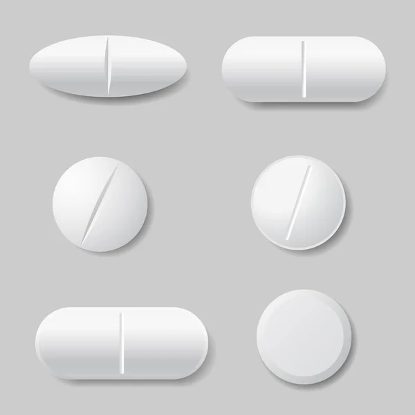 Vektor-Illustrationen weißer Medikamentenpillen, rund und oval - isoliert auf grauem Hintergrund — Stockvektor