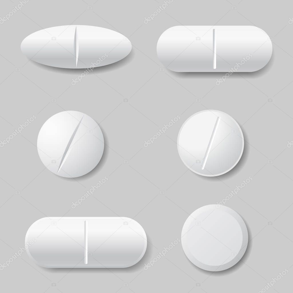 Set of vector illustrations of white medicine pills, round and oval - isolated on gray background