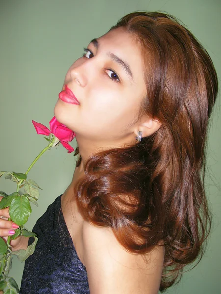 Girl and red rose — Stock Photo, Image