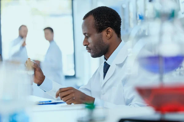 Scientist holding test tube — Stock Photo, Image