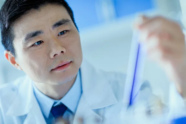 Scientist holding test tube — Stock Photo, Image