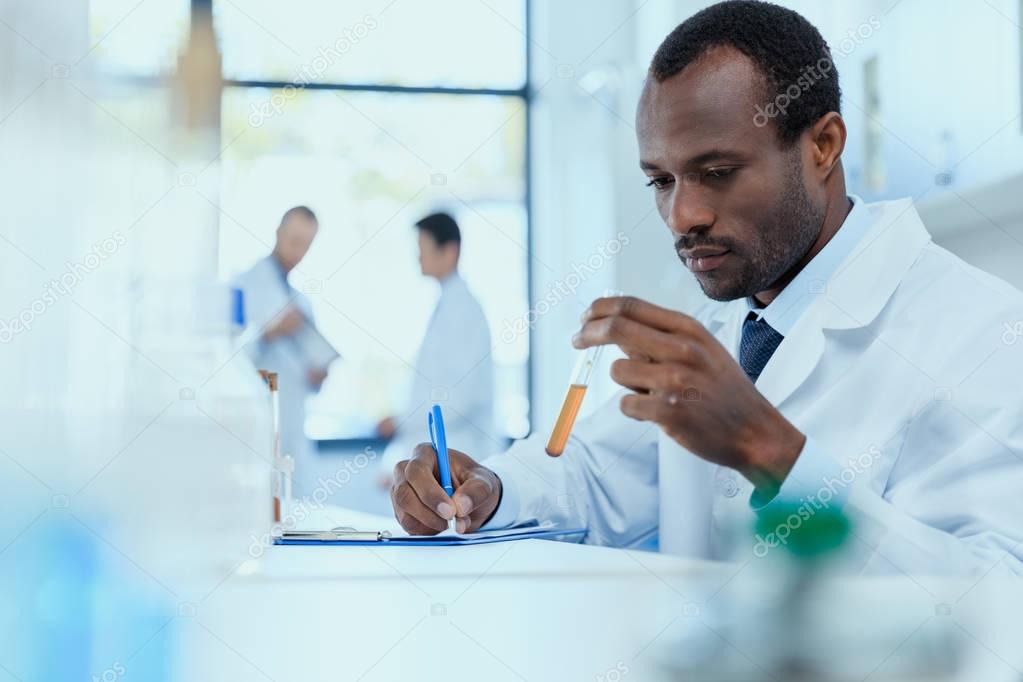 Scientist holding test tube 