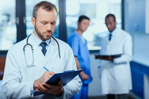 Confident doctor with folder — Stock Photo, Image