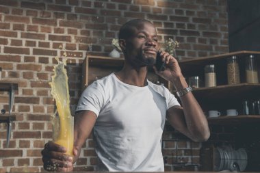 african american man talking on phone clipart