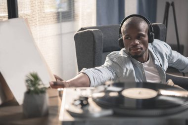 Man listening vinyl record clipart