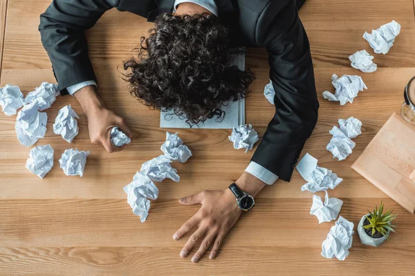 Businessman with crumpled papers — Stock Photo, Image