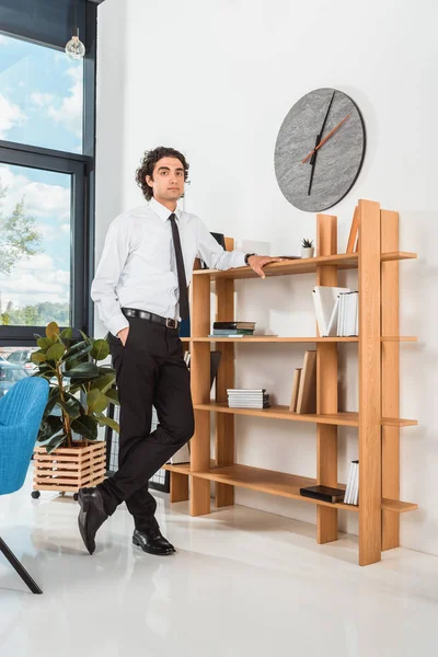 Thoughtful businessman in office — Free Stock Photo