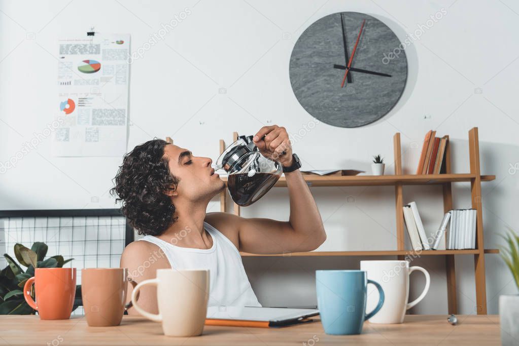 businessman drinking coffee from coffee pot