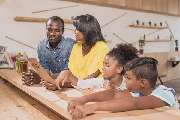 African-american family in cafe — Stock Photo, Image