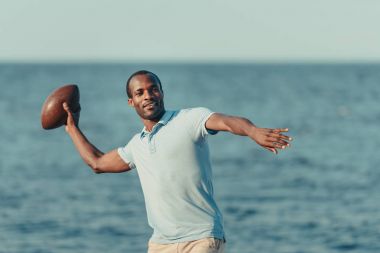 african american man with rugby ball clipart